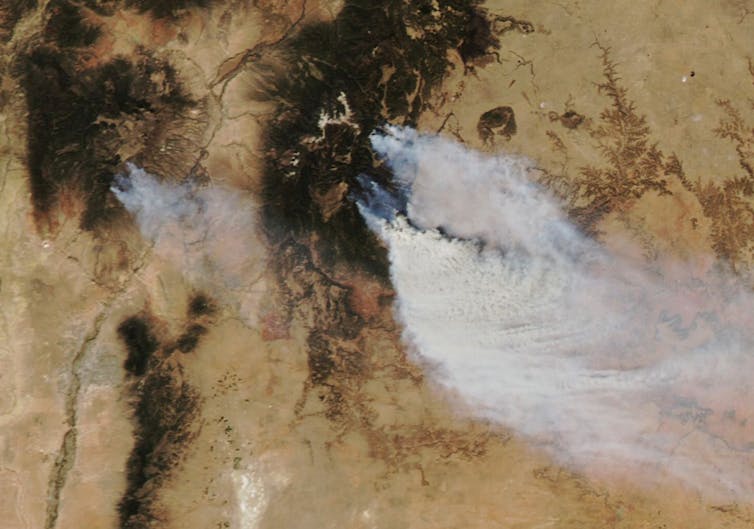 Satellite images shows fires burning near Las Vegas, New Mexico, and Los Alamos.