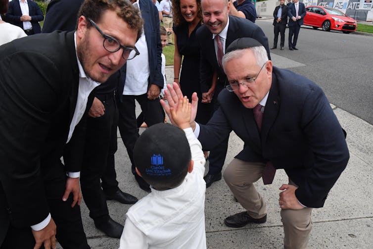 Scott Morrison and Josh Frydenberg campaign at a synagogue in Kooyong.
