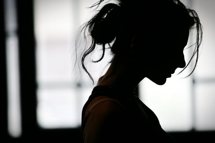 Woman in silhouette.