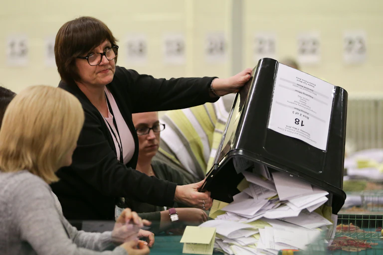 Election officials counting votes.