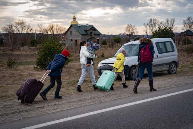 A family fleeing the war in Ukraine.