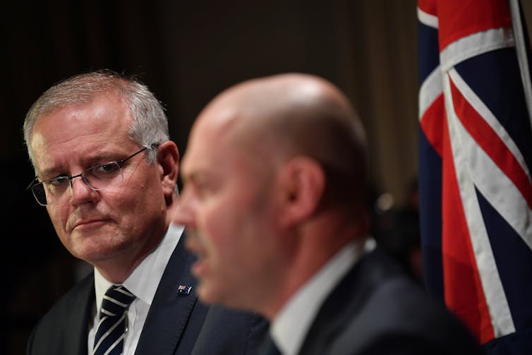 Australian PM Scott Morrison and Treasurer Josh Frydenberg speaking at a press conference in Melbourne