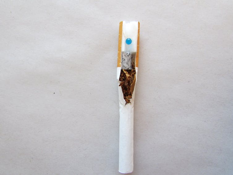 opened up cigarette filter shows blue capsule inside