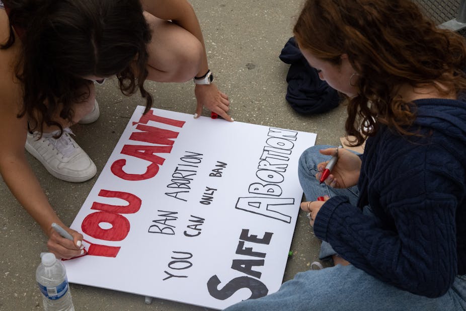 youth writing a poster