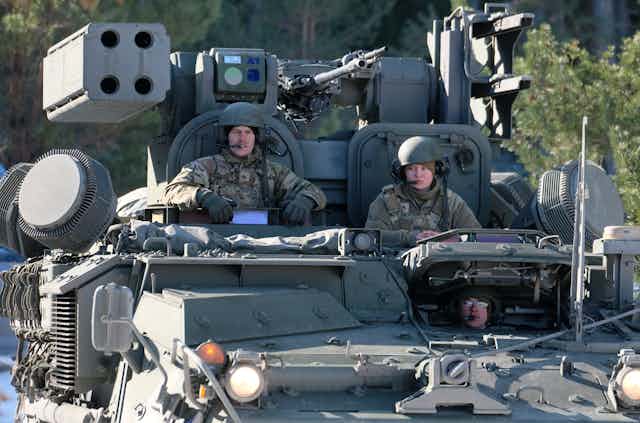 US servicemen get ready to fire Stinger missiles from their Stryker armored fighting vehicle during 'Saber Strike 22' military exercise in Rutja, Estonia, 10 March 2022. 