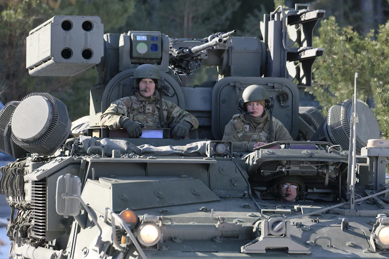 US servicemen get ready to fire Stinger missiles from their Stryker armored fighting vehicle during 'Saber Strike 22' military exercise in Rutja, Estonia, 10 March 2022.