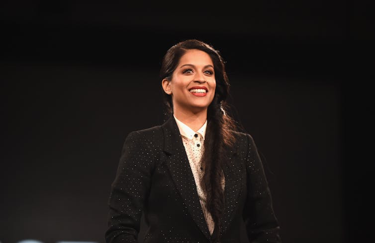 Woman dressed in black smiles.