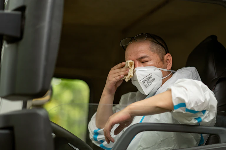 Shanghai refuse worker in COVID protective gear