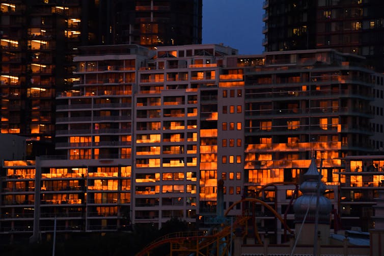 apartment windows reflecting sunset