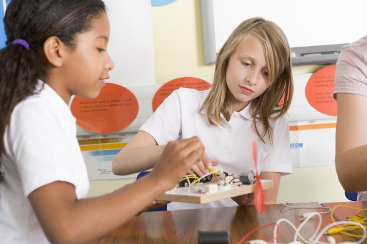 Two girls in science class
