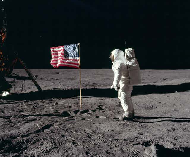 A photo of Buzz Aldrin saluting the U.S. flag on the Moon.