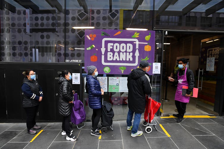 people lined up outside food bank