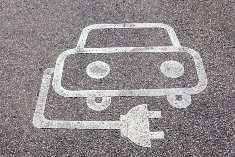 Empty parking space reserved for electric vehicles.