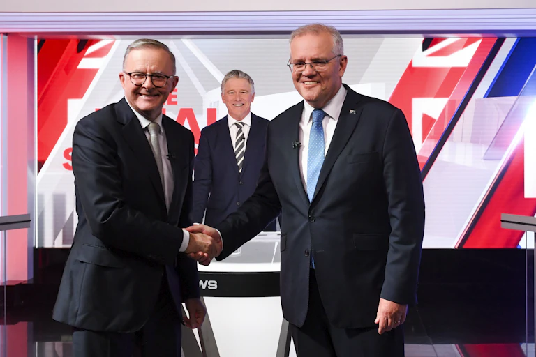 Prime Minister Scott Morrison and Opposition Leader Anthony Albanese shaking hands at the third and final leaders' debate