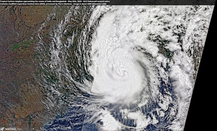 A composite satellite image of a large white cyclone