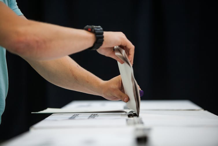 Man casting his vote during a political election