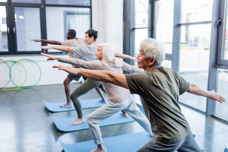 Older people doing yoga