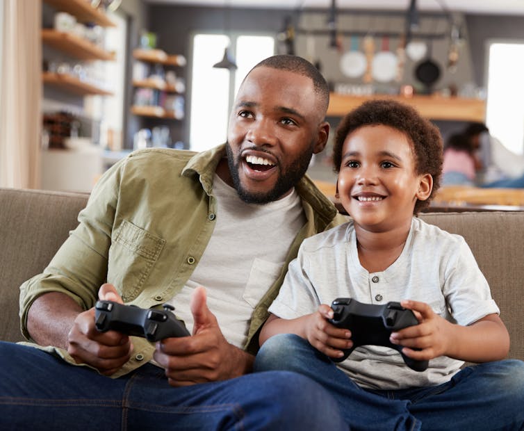 image of a father and son gaming.