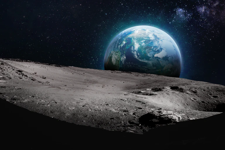 A view of the Earth from the Moon's grey, rocky surface