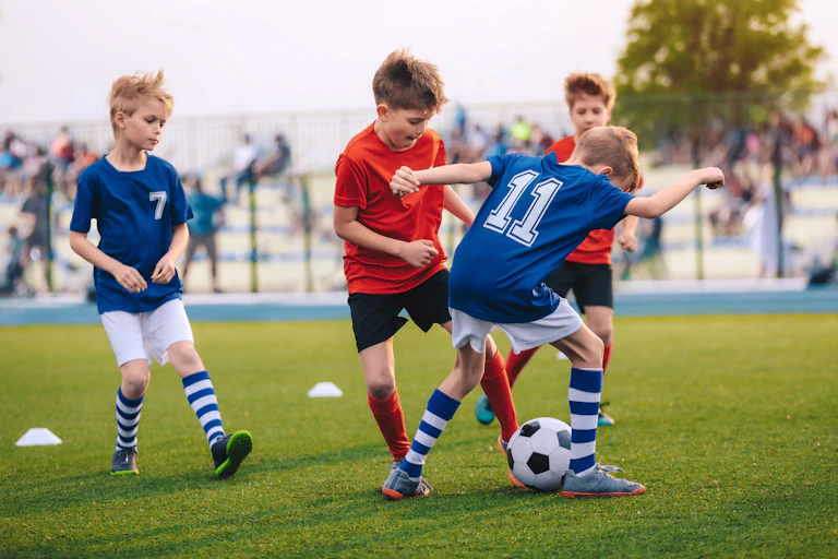 A group of boys playing football.