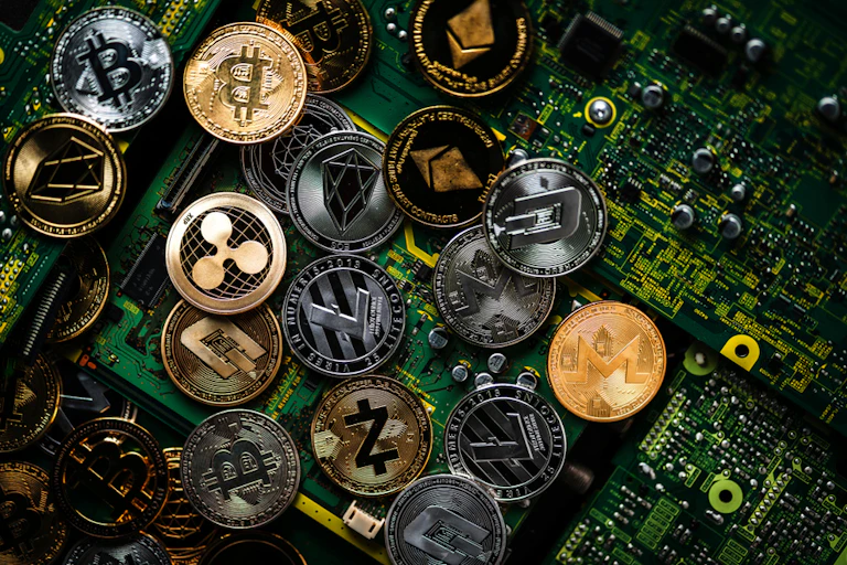 Various crypto coins on a circuit board.