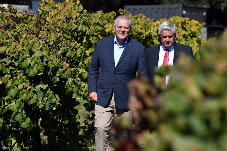 Morrison campaigns with frontbencher Ken Wyatt at a winery.