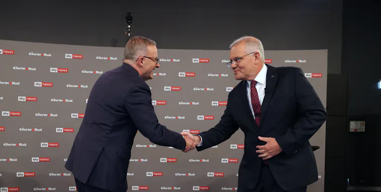 Anthony Albanese and Scott Morrison shake hands at the first leaders debate of the 2022 election campaign, on April 20 20222.