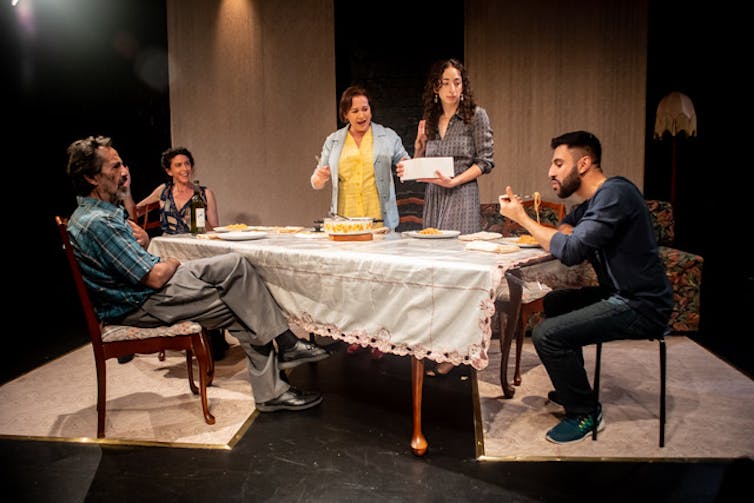 Production image: a family around the dinner table