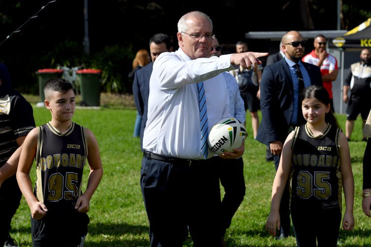 Scott Morrison and junior rugby players.