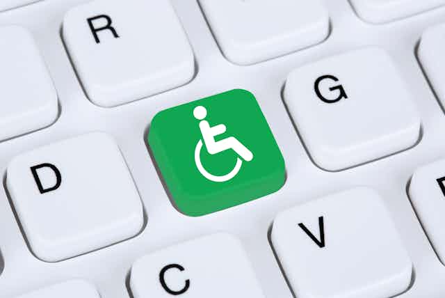 Rendered image of a close up of a keyboard key showing a wheelchair