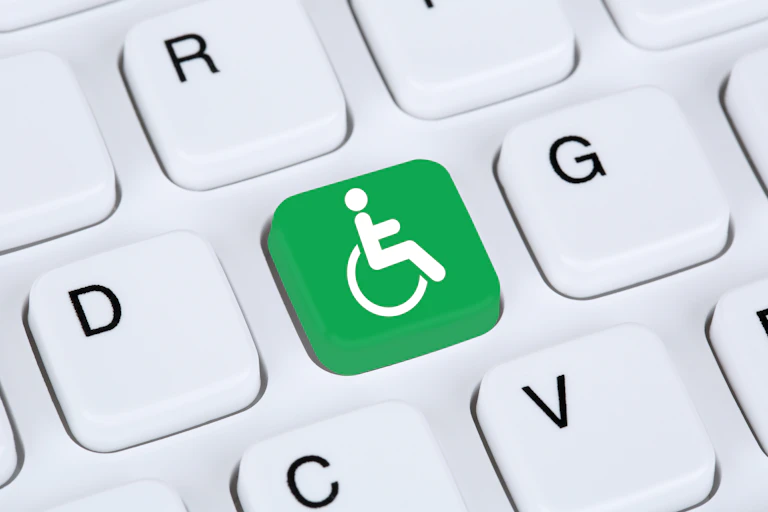 Rendered image of a close up of a keyboard key showing a wheelchair
