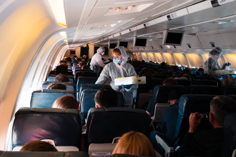 Plane with people in PPE