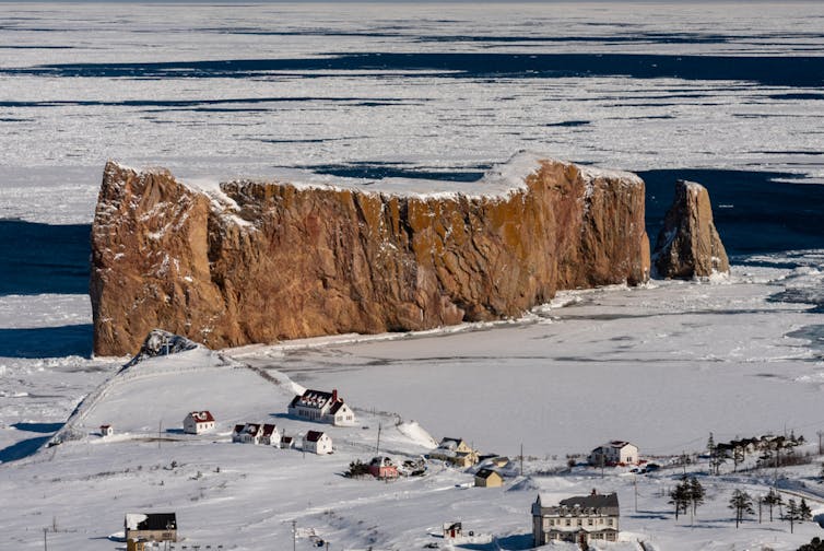 Rocher Percé and the small town, under the snow