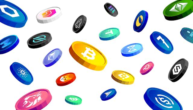 Colourful coins emblazoned with cryptocurrency logos on a white background.
