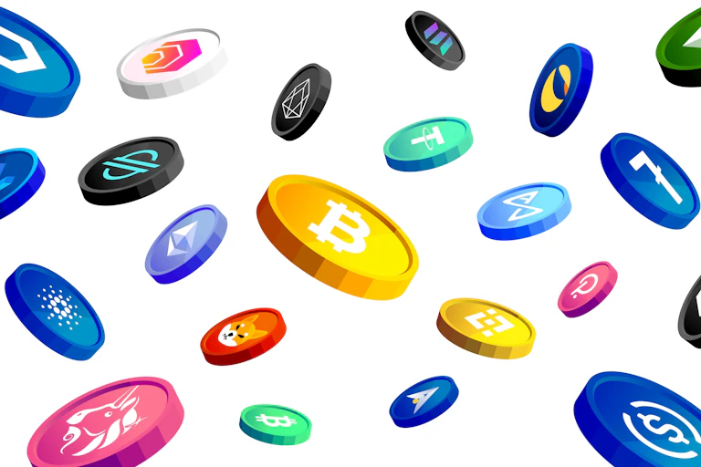 Colourful coins emblazoned with cryptocurrency logos on a white background.