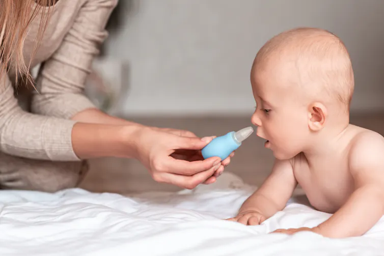Baby with nasal saline solution