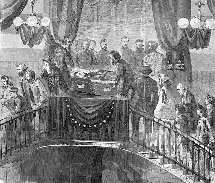 A black and white illustration shows a line of people paying respects at a funeral.