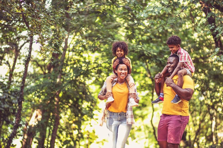 A family walk through a forest