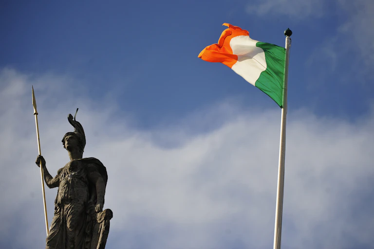 Irish flag and statue