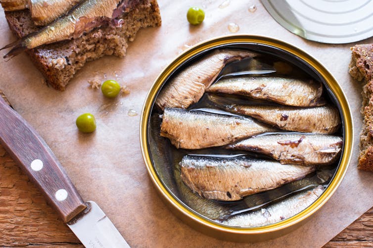 An opened can of tinned sardines.