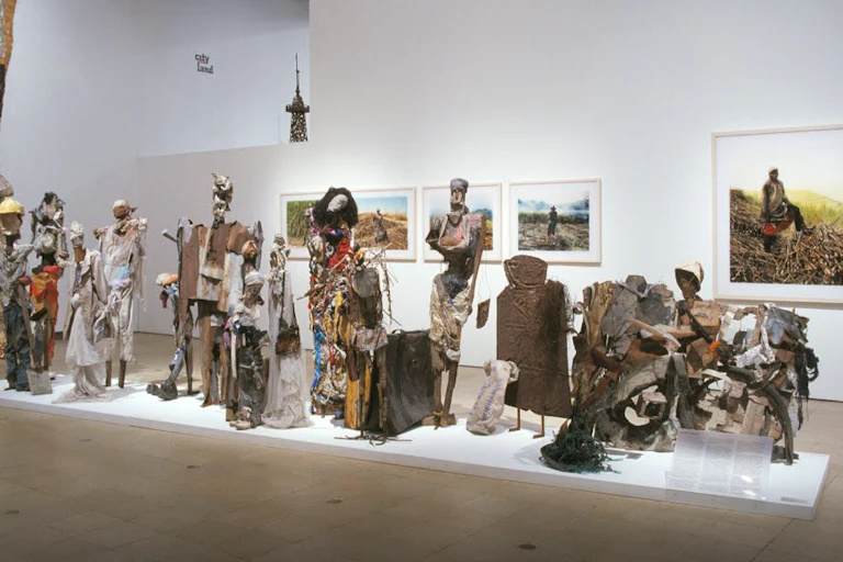 display of art on a white shelf and white wall background.