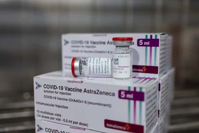 Vials of the AstraZeneca vaccine sit on boxes of the AstraZeneca vaccine.
