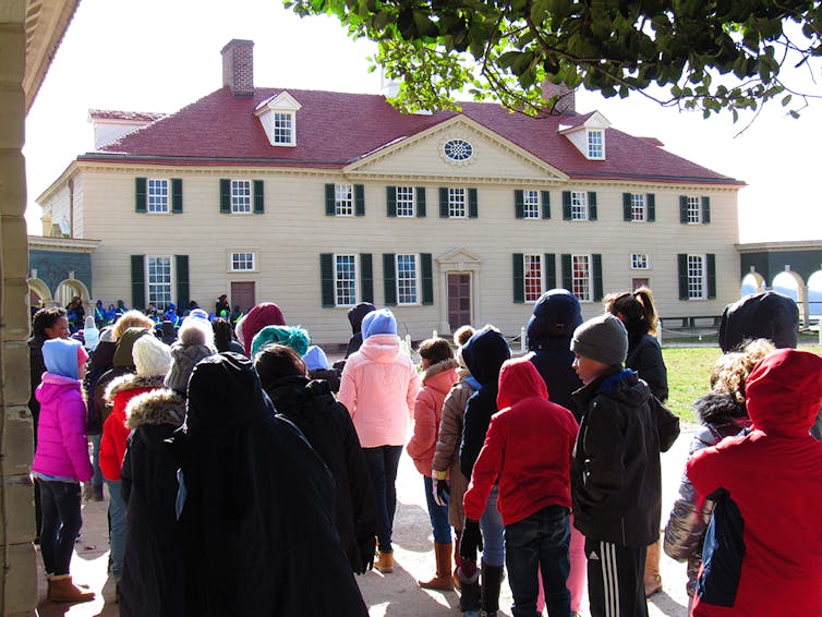 People standing in line in front of George Washington's Mount Vernon