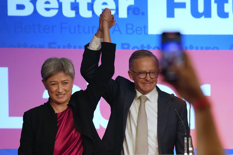 Penny Wong and Anthony Albanese celebrate on election night