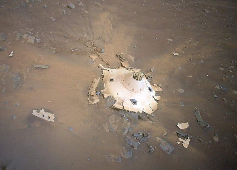 Image of wreckage, deliberately crashed on Mars, seen from above.