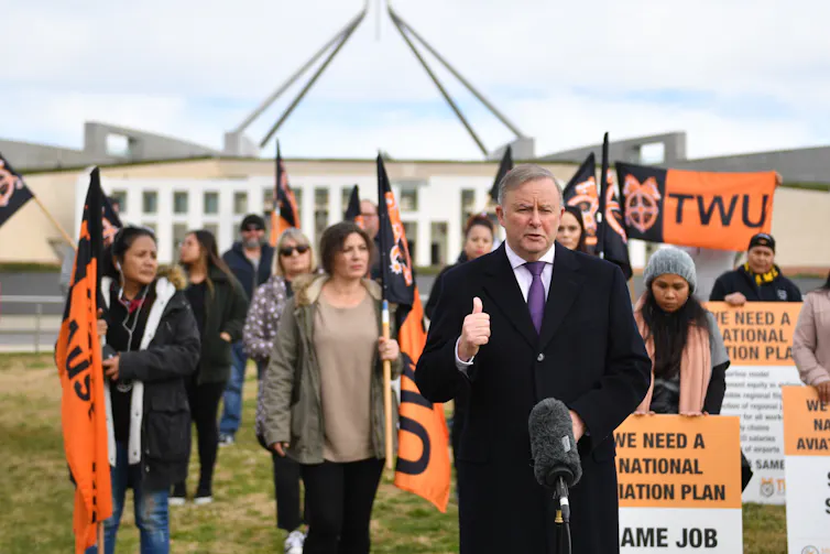 Anthony Albanese with members of the Transport Workers Union outside Parliament House in June 2020. The unionists were protesting against JobSeeker payments not being available to aircraft cleaners, caterers, security guards, baggage handlers and ramp wor