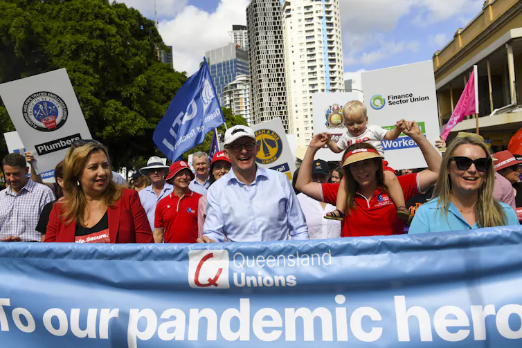 Anthony Albanese, centre, attends the Labour Day march in Brisbane on May 2 2022.