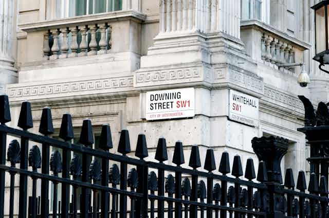 Street signs where Downing Street meets Whitehall