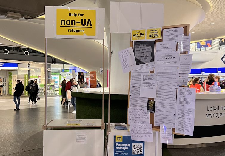 a bulletin board and an empty booth