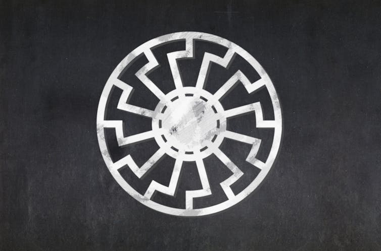A white wheel design on a black background.